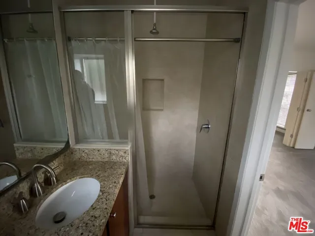 a bathroom with a sink and mirror