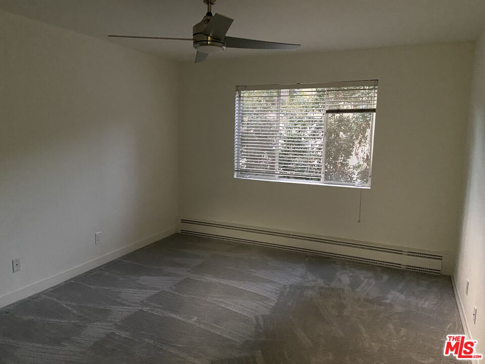 10655 Wilshire Boulevard, Unit 303 Los Angeles, CA 90024 - Photo 15 of 27 a view of an empty room with a window