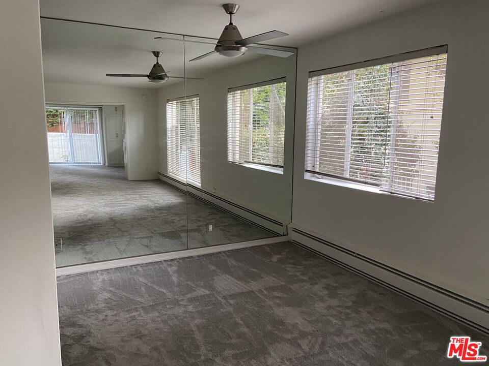 10655 Wilshire Boulevard, Unit 303 Los Angeles, CA 90024 - Photo 7 of 27 a view of an empty room with a window