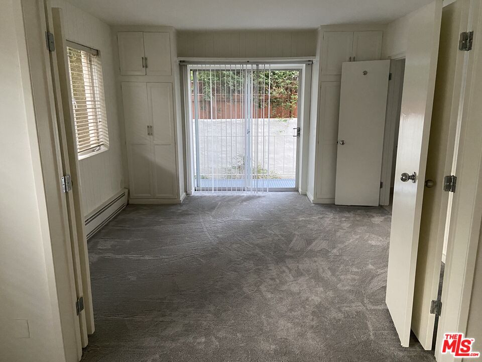 10655 Wilshire Boulevard, Unit 303 Los Angeles, CA 90024 - Photo 8 of 27 an empty room with windows