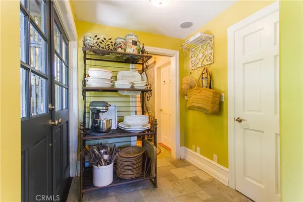 a bathroom with a sink and mirror with bathtub