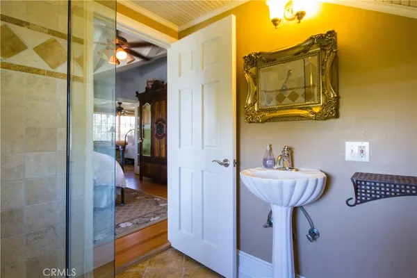 a bathroom with a sink toilet a mirror and shower