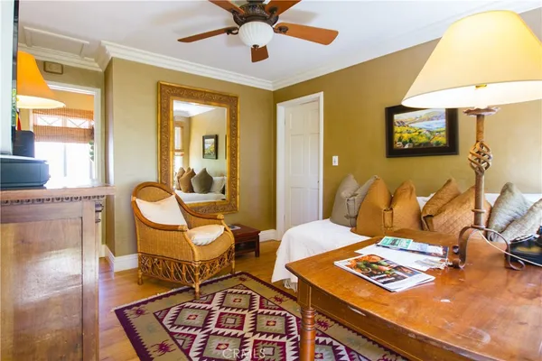 a room with furniture a rug and a window