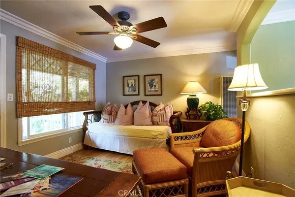 a living room with furniture and a mirror