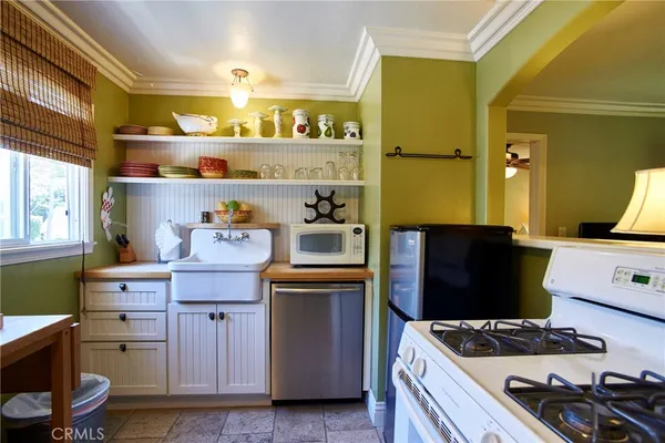 a bedroom with furniture and a potted plant