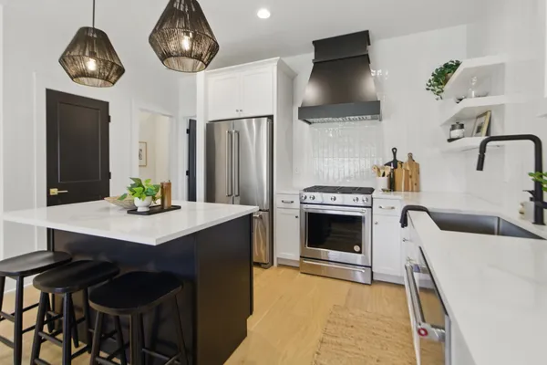 a kitchen with a table and chairs in it
