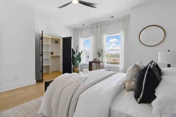 a bedroom with a bed and a closet
