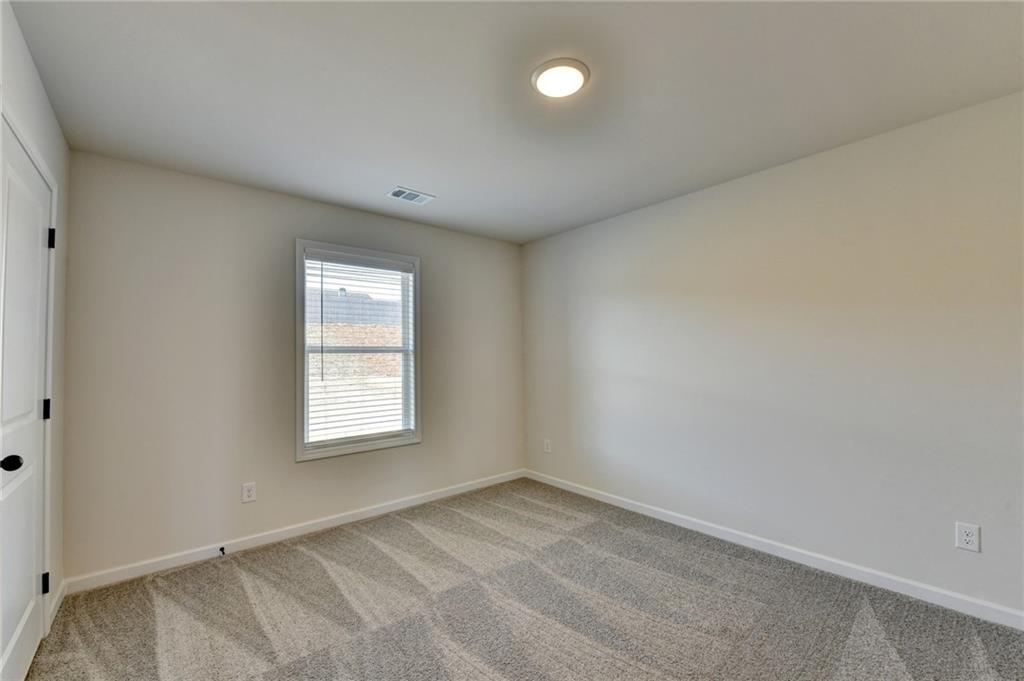 646 Rodeo Drive Auburn, GA 30011 - Photo 19 of 26 an empty room with a window
