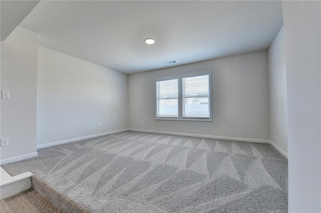 646 Rodeo Drive Auburn, GA 30011 - Photo 21 of 26 an empty room with windows