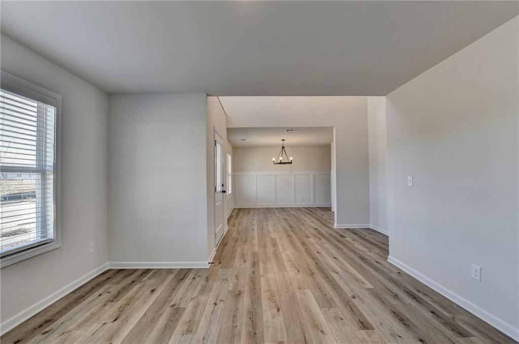 646 Rodeo Drive Auburn, GA 30011 - Photo 6 of 26 a view of wooden floor in an empty room