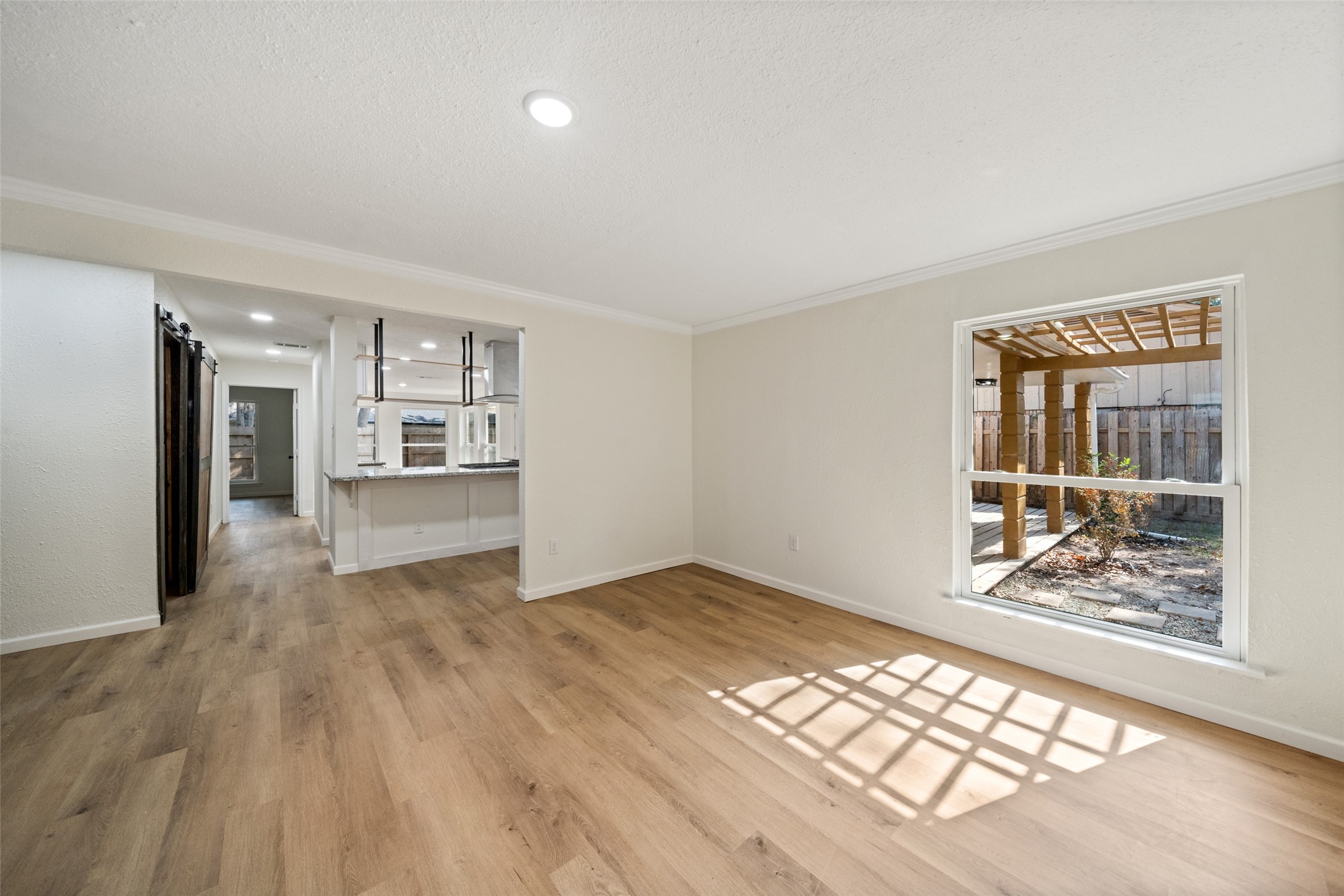 238 Point Clear Drive Conroe, TX 77304 - Photo 14 of 20 wooden floor in an empty room with a window