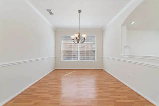 a view of a room with window wooden floor and ceiling fan