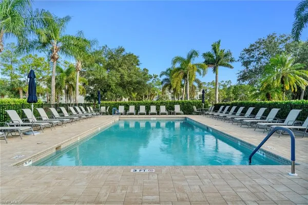a view of swimming pool with chairs