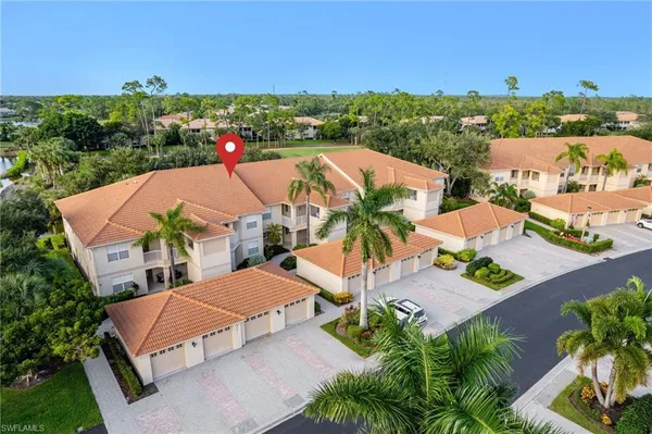 an aerial view of a house with a big yard