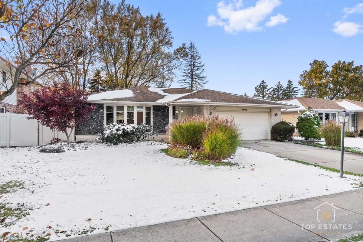 1802 Aspen Drive Mount Prospect, IL 60056 - Photo 1 of 30 a front view of a house with a yard