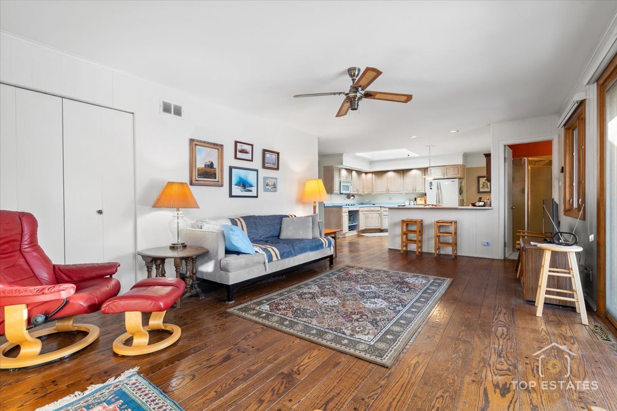1802 Aspen Drive Mount Prospect, IL 60056 - Photo 11 of 30 a living room with furniture and wooden floor