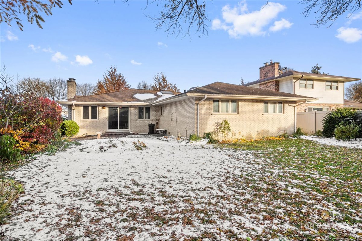 1802 Aspen Drive Mount Prospect, IL 60056 - Photo 26 of 30 a front view of a house with a garden
