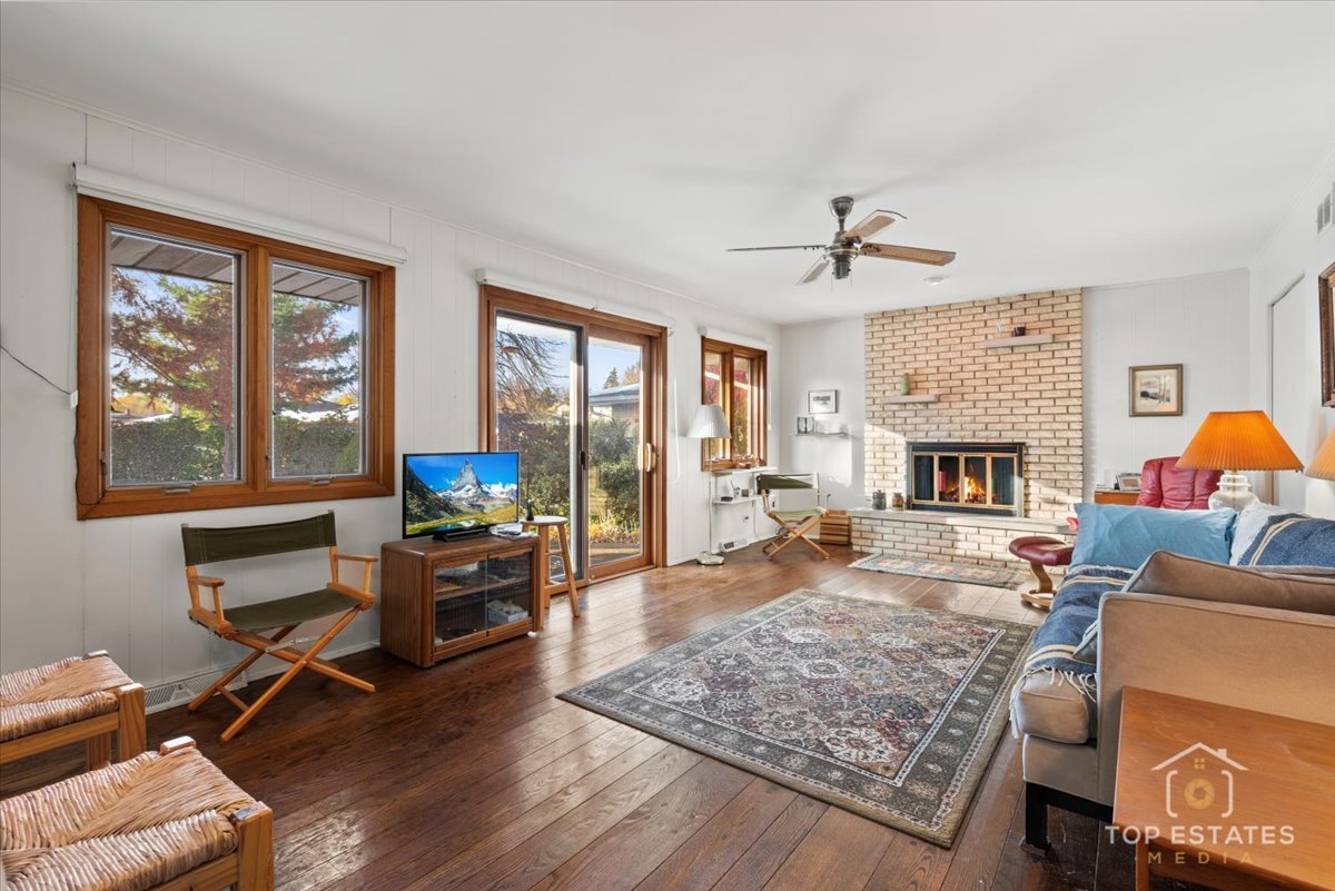1802 Aspen Drive Mount Prospect, IL 60056 - Photo 9 of 30 a living room with furniture and a fireplace