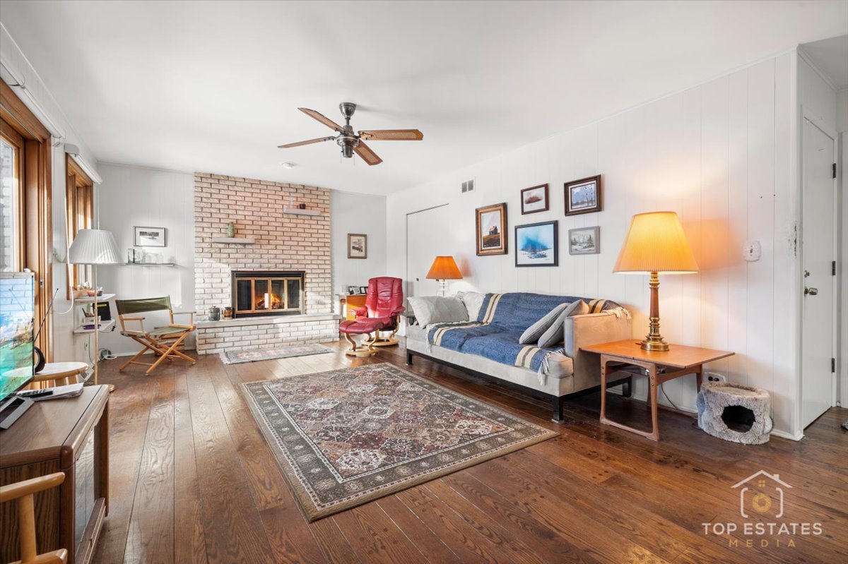 1802 Aspen Drive Mount Prospect, IL 60056 - Photo 10 of 30 a living room with furniture and a fireplace