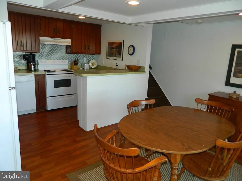 332 Thorsby Road Annapolis, MD 21405 - Photo 20 of 30 a kitchen with a sink a stove and chairs