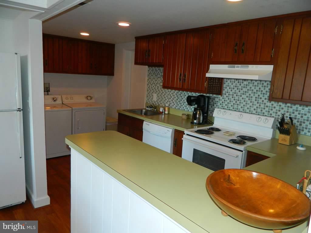 332 Thorsby Road Annapolis, MD 21405 - Photo 21 of 30 a kitchen with stainless steel appliances granite countertop a sink stove and refrigerator