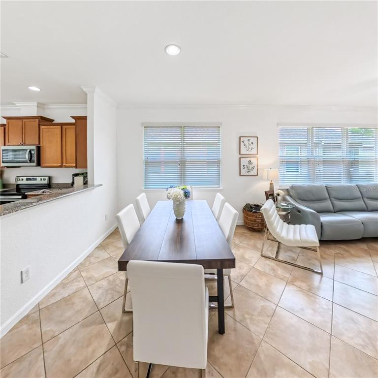 9117 Southwest 70th Loop Ocala, FL 34481 - Photo 12 of 24 a view of a dining room with furniture