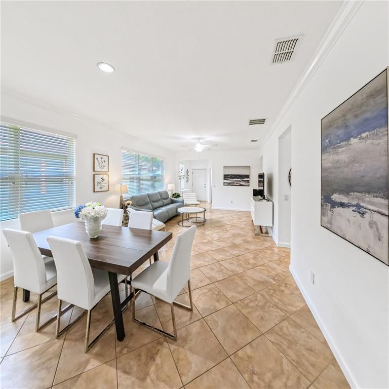 9117 Southwest 70th Loop Ocala, FL 34481 - Photo 14 of 24 a view of a dining room with furniture