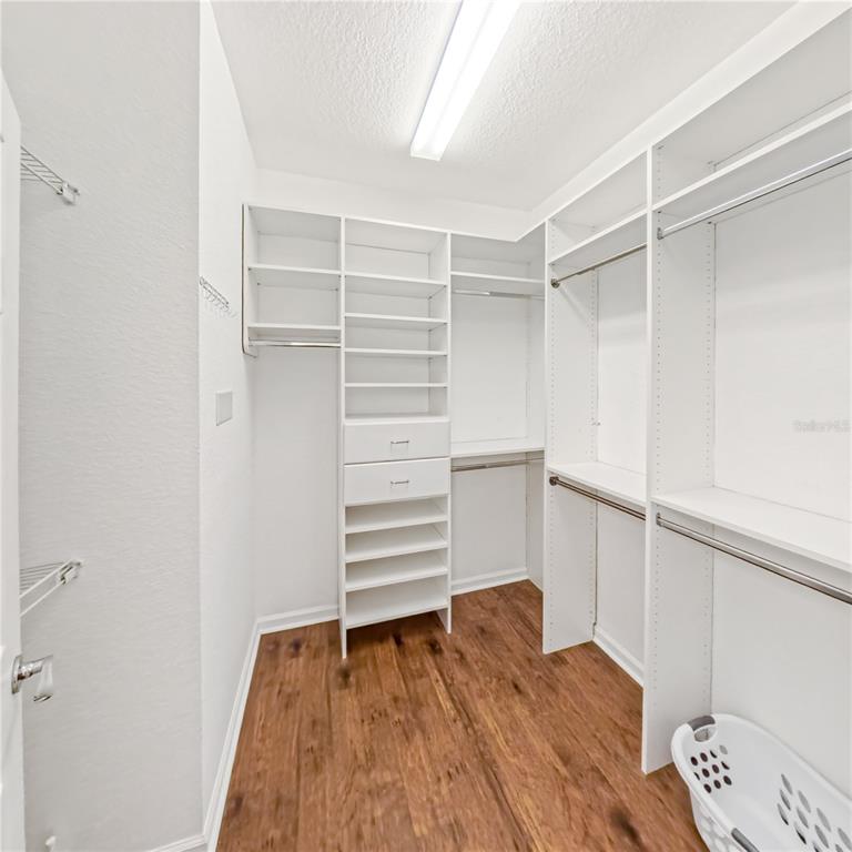 9117 Southwest 70th Loop Ocala, FL 34481 - Photo 18 of 24 a view of walk in closet with empty racks