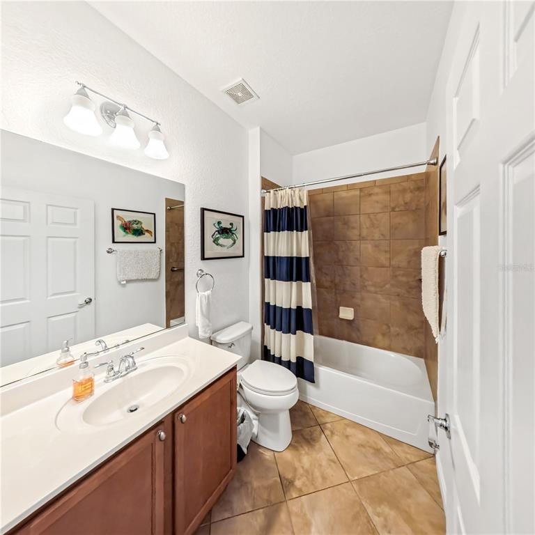 9117 Southwest 70th Loop Ocala, FL 34481 - Photo 22 of 24 a bathroom with a sink toilet and shower