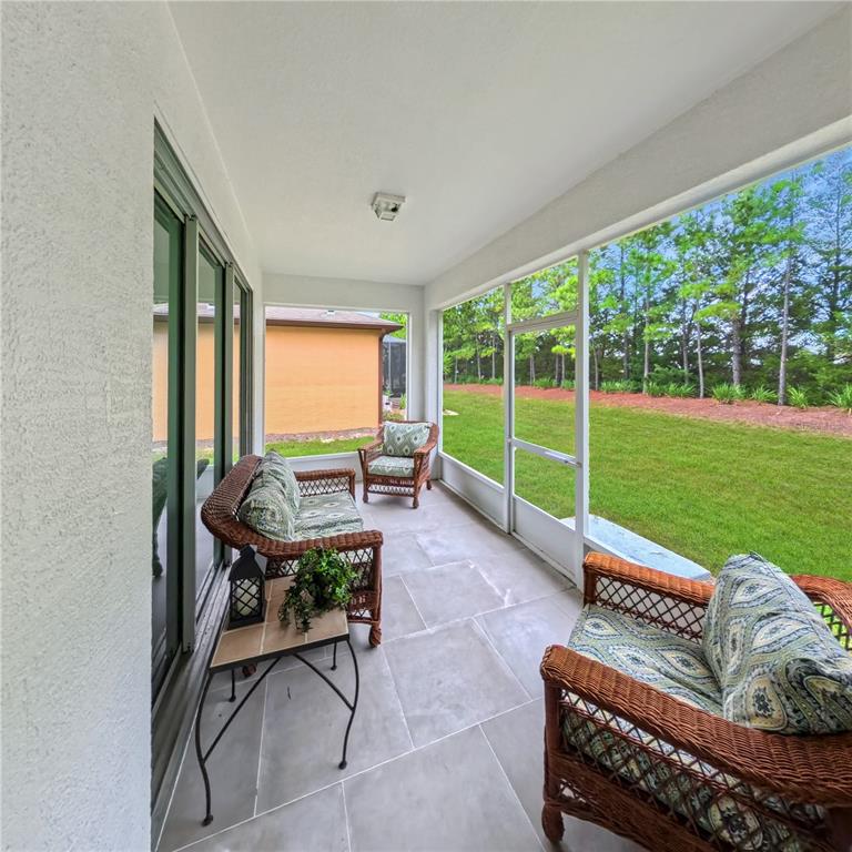 9117 Southwest 70th Loop Ocala, FL 34481 - Photo 23 of 24 a living room with furniture and a large window