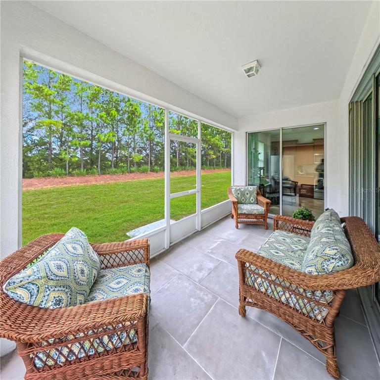 9117 Southwest 70th Loop Ocala, FL 34481 - Photo 24 of 24 a living room with furniture and a large window