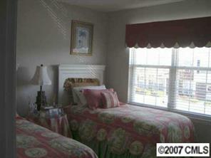 754 Shellstone Place Fort Mill, SC 29708 - Photo 5 of 8 a bedroom with a bed and a large window