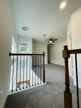 a view of hallway with livingroom