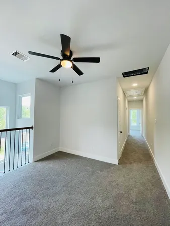 a view of room with ceiling fan