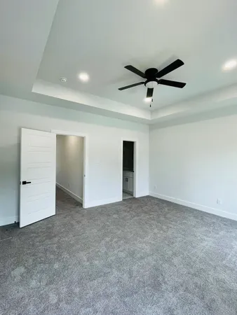a bathroom with a glass shower door