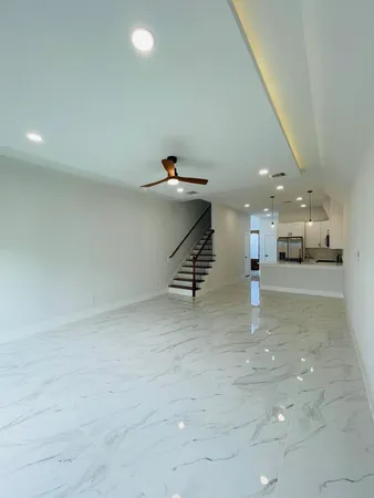 a spacious bedroom with a large bed and a window