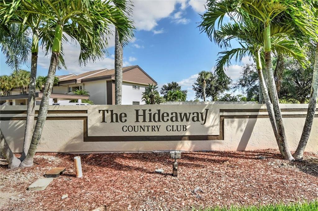 5665 Trailwinds Drive, Unit 616 Fort Myers, FL 33907 - Photo 1 of 29 a sign that is on the side of the road