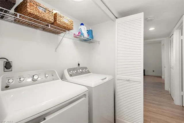 a bathroom with a granite countertop sink toilet mirror and shower