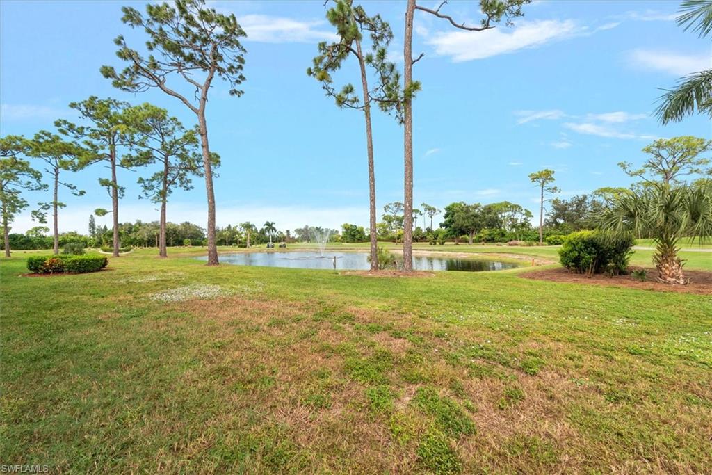 5665 Trailwinds Drive, Unit 616 Fort Myers, FL 33907 - Photo 23 of 29 a view of a grassy field with an trees