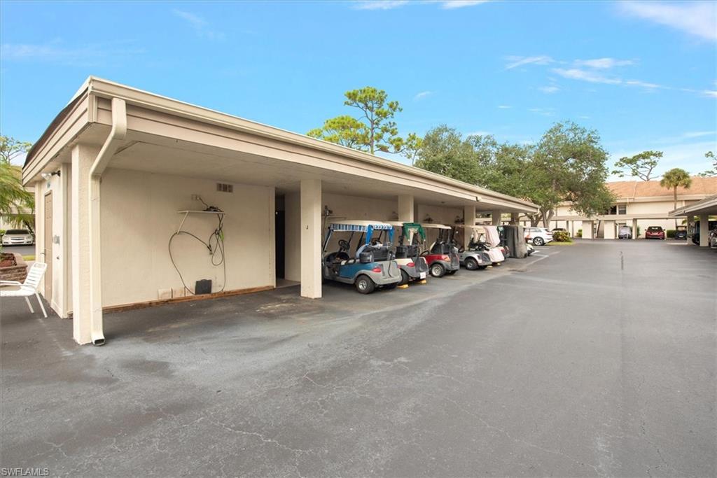 5665 Trailwinds Drive, Unit 616 Fort Myers, FL 33907 - Photo 25 of 29 a view of car parked in front of a house