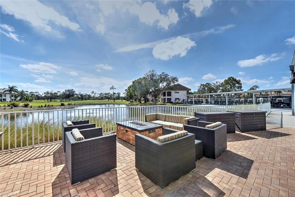 5665 Trailwinds Drive, Unit 616 Fort Myers, FL 33907 - Photo 26 of 29 a view of a lake with couches chairs