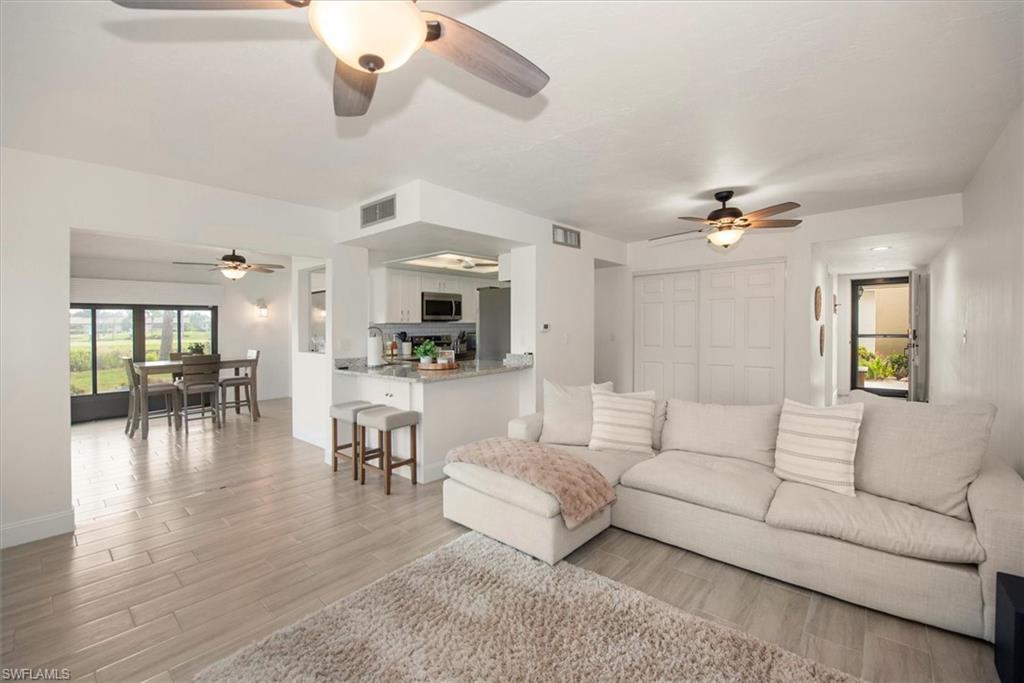 5665 Trailwinds Drive, Unit 616 Fort Myers, FL 33907 - Photo 8 of 29 a living room with furniture