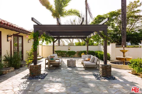 a view of yard with patio