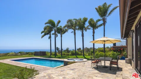 a view of a backyard with sitting area and furniture