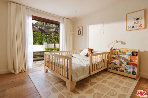 a bed room with furniture and a window