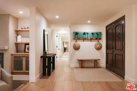 a view of a kitchen with a sink and a refrigerator