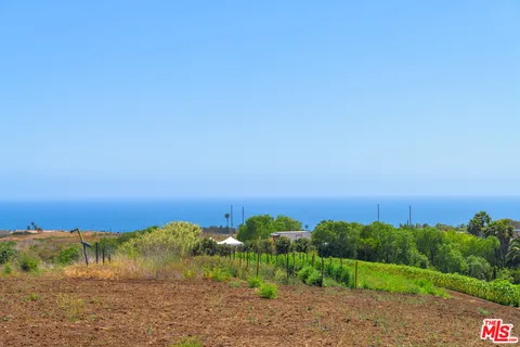 a view of a lake with a yard