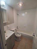174 Pine Street, Unit 23 Holbrook, MA 02343 - Photo 6 of 25 a bathroom with a sink a toilet and shower
