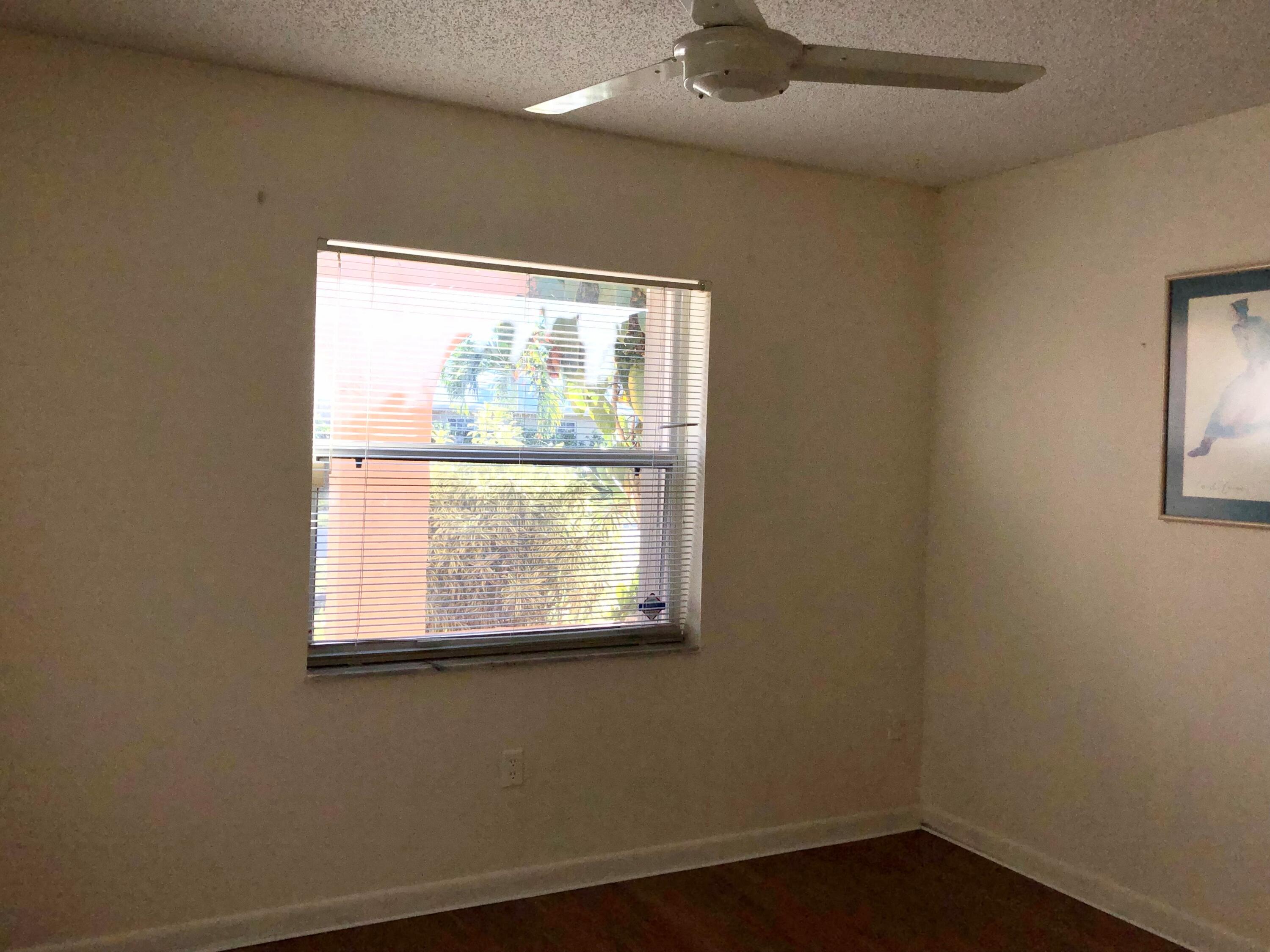 4535 Baldric Street Boca Raton, FL 33428 - Photo 12 of 19 an empty room with a window