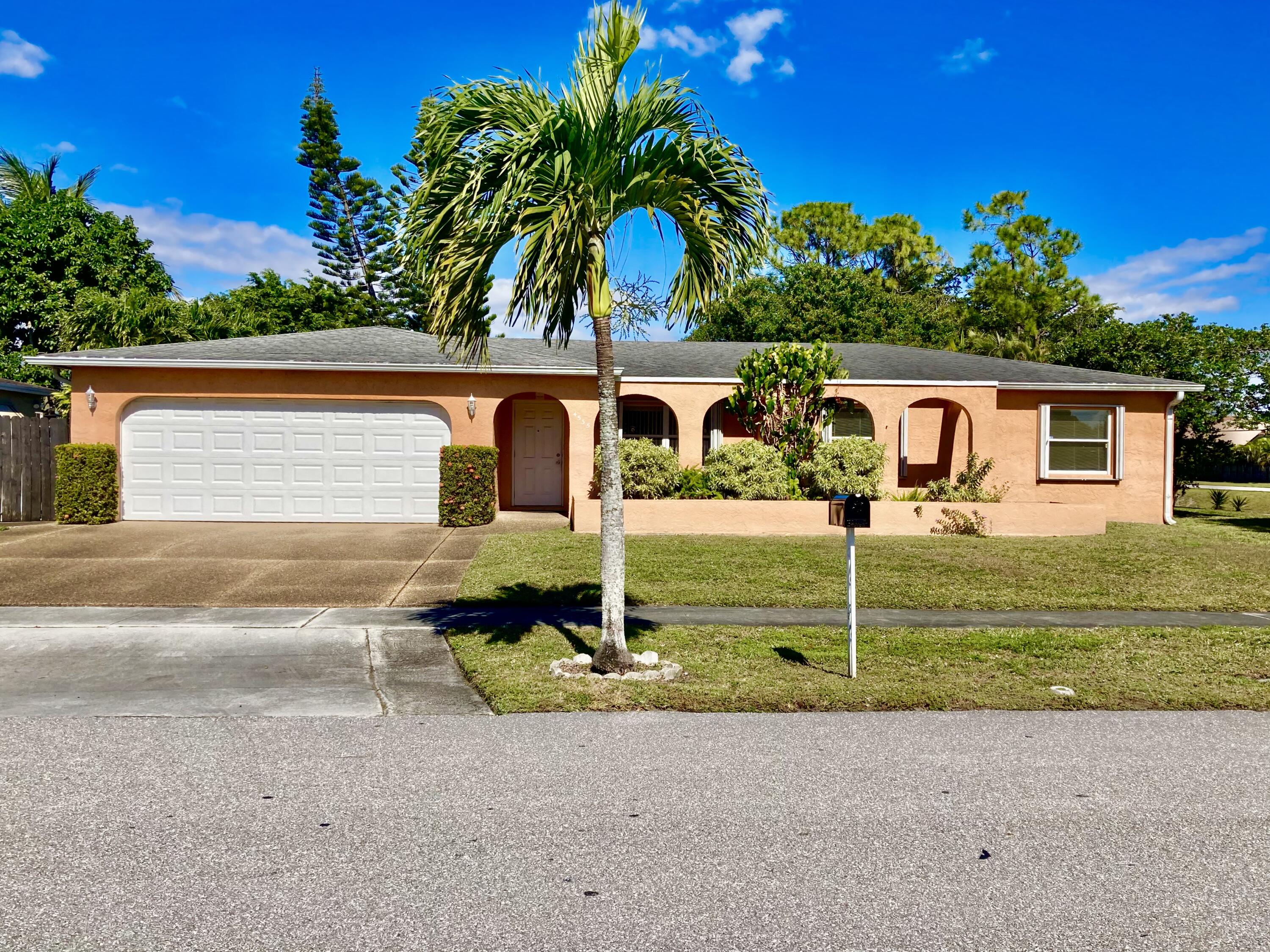 4535 Baldric Street Boca Raton, FL 33428 - Photo 19 of 19 a view of a house with a yard